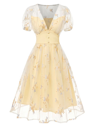 Gelbes 50er Kleid mit V-Ausschnitt und Blumen