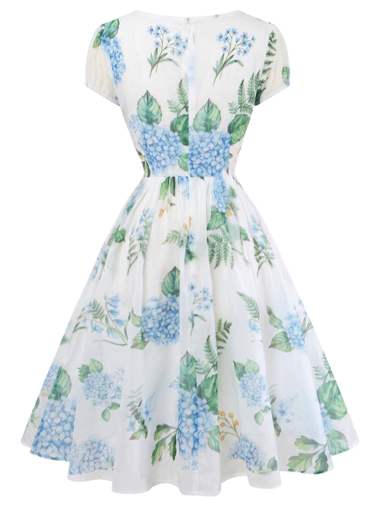 Blaues 50er Swingkleid mit Blumen-Print und V-Ausschnitt
