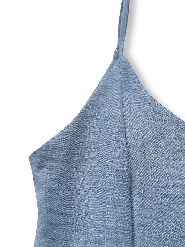 Blauer Jumpsuit im Stil der 1930er Jahre mit tiefem V-Ausschnitt, Stufenrock und Raffungen