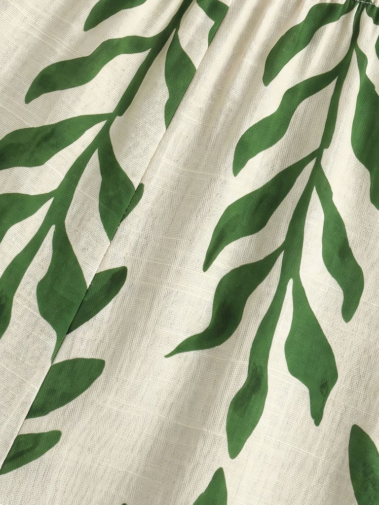 Grüner 60er Tropen Jumpsuit mit Spaghettiträger und Print