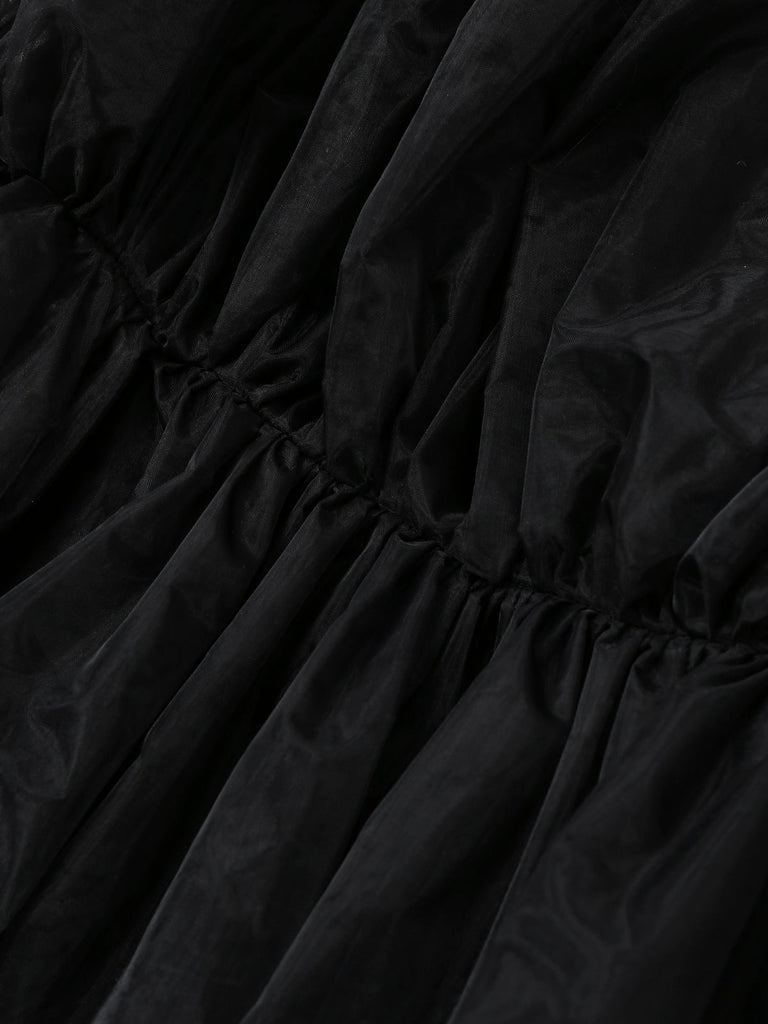 Schwarzes trägerloses 80er Meshkleid in Schleifenoptik mit Vokuhila-Saum