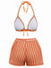 Orangefarbenes und weißes Bikini-Set auf weißem Hintergrund