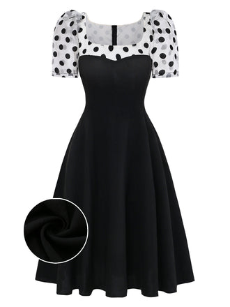 Schwarzes 1940er-Patchworkkleid mit Puffärmeln und Polka Dots