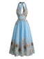 Tiefblaues 50er Kleid mit Sonnenblumen-Print und Neckholder