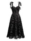 Schwarzes 50er Midikleid mit Samt-Blumen und Bindeträgern