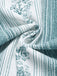 Hellblauer 70er Jumpsuit mit Blumen und Gürtel