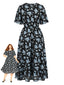 [Übergröße] Schwarzes 40er Swingkleid mit blauen Blumen und kurzen Ärmeln