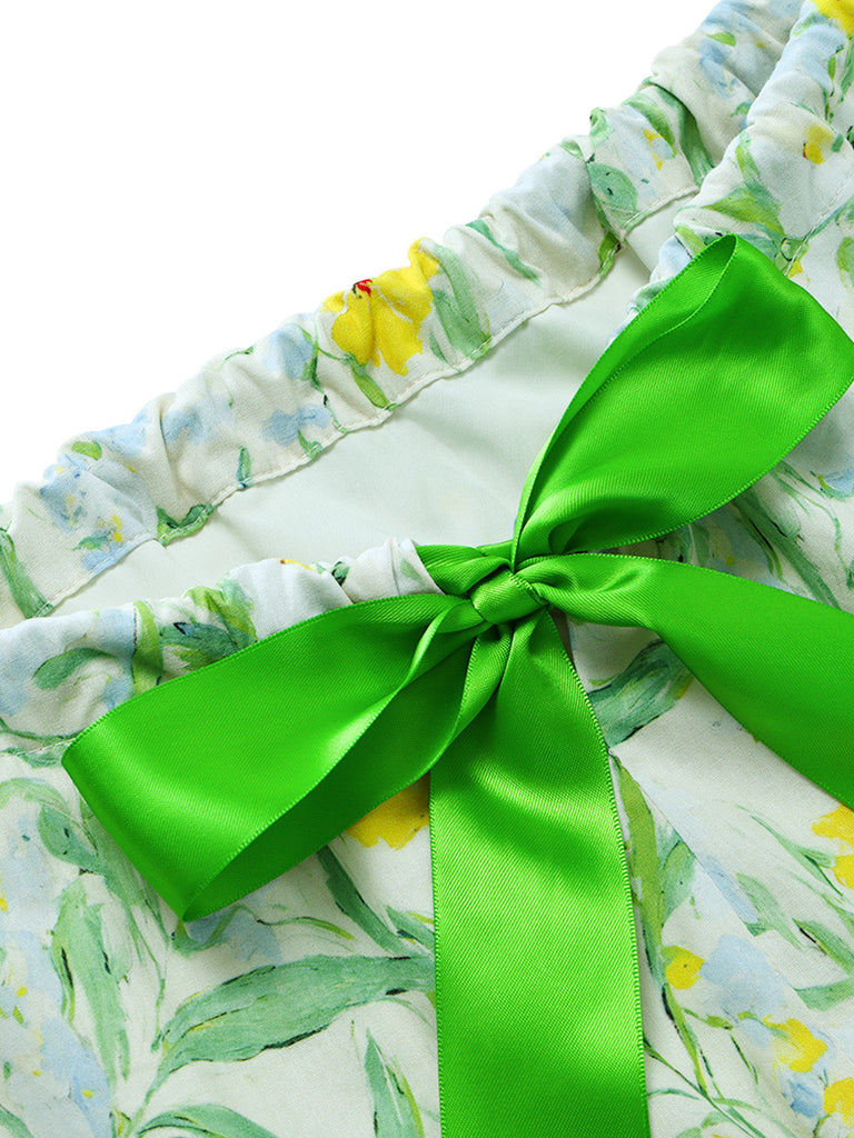 Grünes 50er Kleid mit Blumen und Schleife