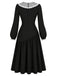 Schwarzes 50er Kleid mit transparentem Spitzenkragen und Schleife