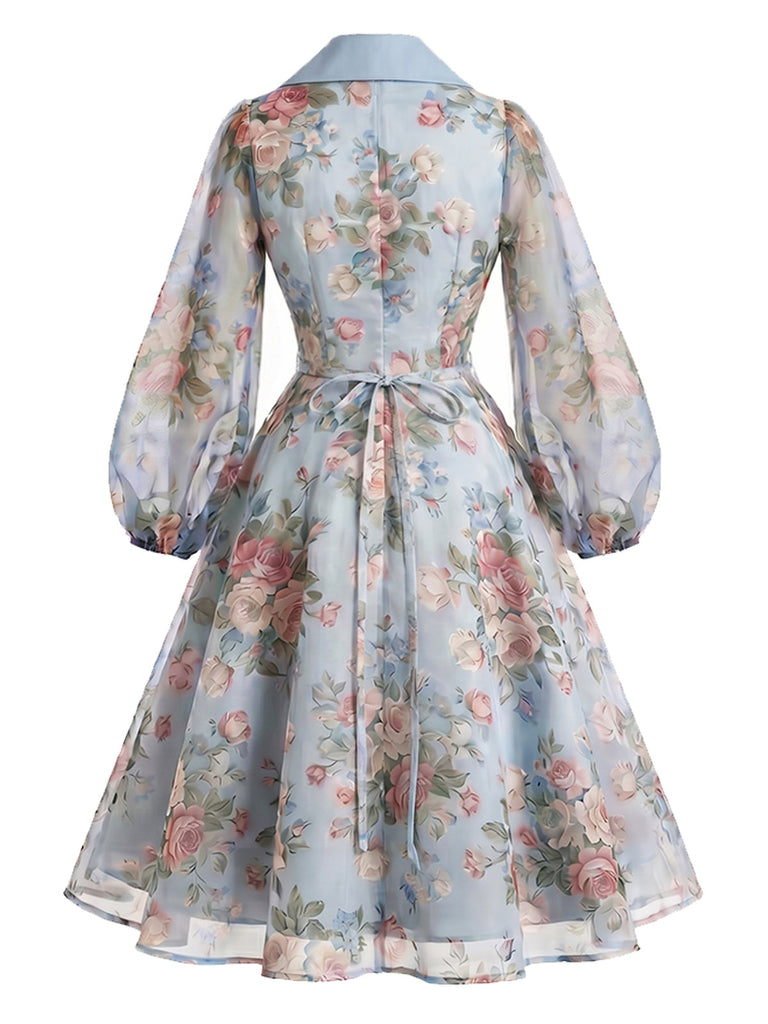 Blaues 50er Wickelkleid mit Blumen und Reverskragen