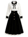 Schwarzes & weißes 50er Kleid mit Knöpfen, Kontrastschleife und Ballonärmeln