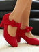 Pumps mit Schleife und Blockabsatz