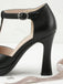 Schwarze T-Strap-Schuhe mit hohem Absatz