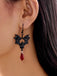 Gothic Schwarze Fledermaus-Ohrringe mit roten Kristallen