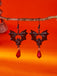 Gothic Schwarze Fledermaus-Ohrringe mit roten Kristallen