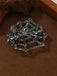 Brosche mit Strass und Spinnennetz