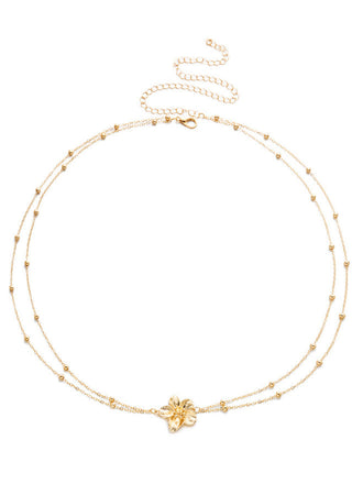 Golder Body mit Blumen und Perlen