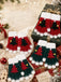 Fingerlose Weihnachts-Strickhandschuhe mit Tannenbäumen und Bommeln