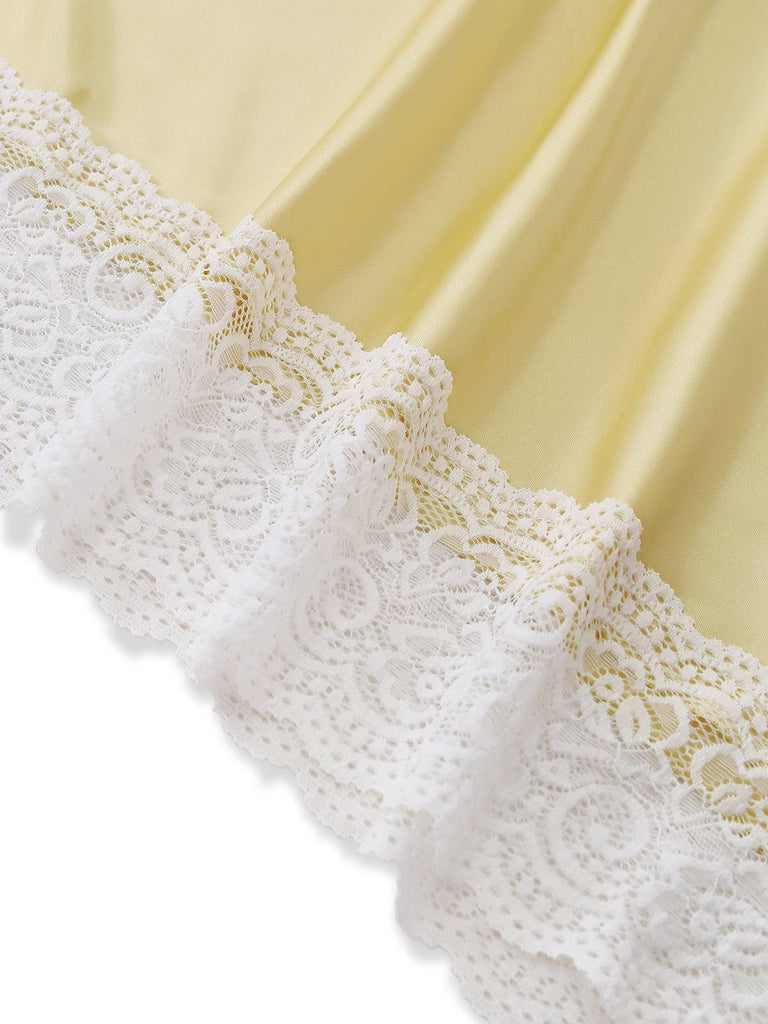 Gelbes Nachthemd mit V-Ausschnitt und asymmetrischem Saum aus Spitze, der ein ungleichmäßiges Kantendesign und eine feine Verarbeitung für elegante Nachtwäsche aufweist
