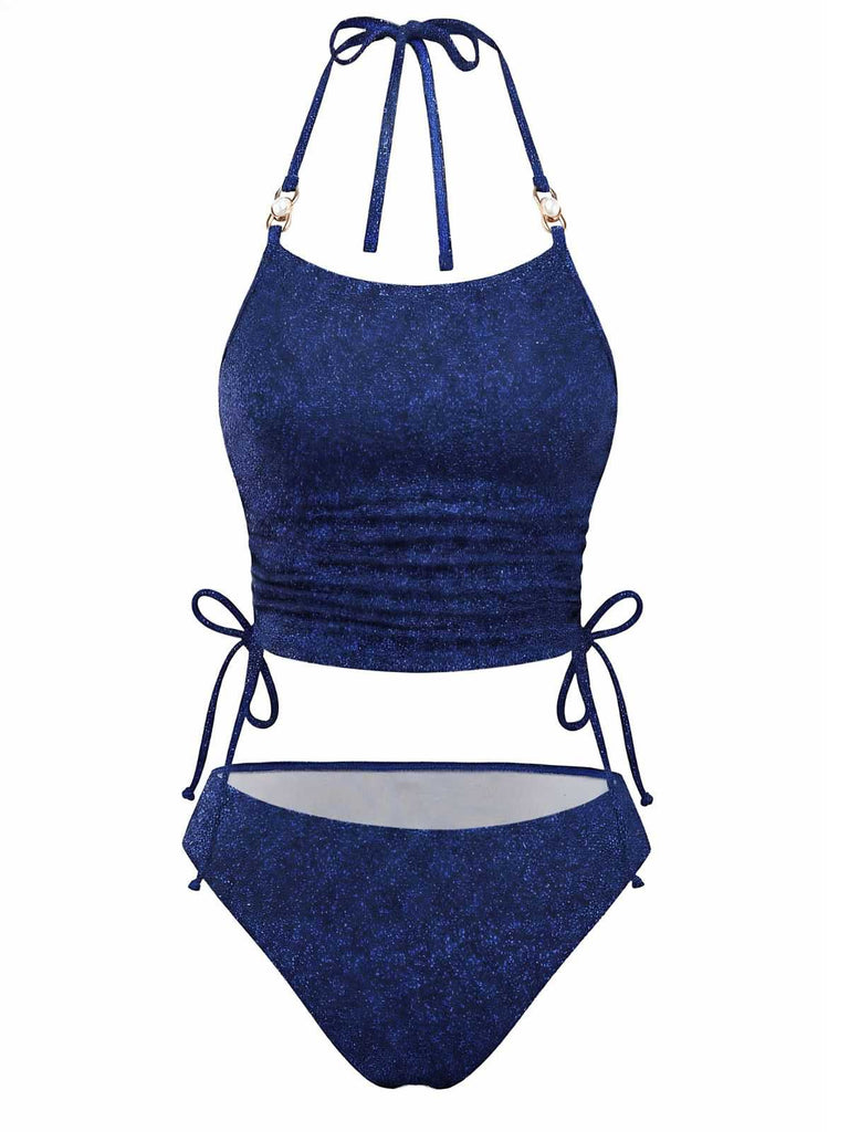 Vorderansicht des marineblauen Glitzer-Tankini-Sets mit verstellbaren Neckholder-Trägern und gerafftem Oberteil.