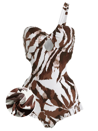 [Vorverkauf] Dunkelbrauner, einteiliger Badeanzug im Stil der 1950er Jahre mit asymmetrischem Schulterausschnitt und raffiniertem Twist-Detail.