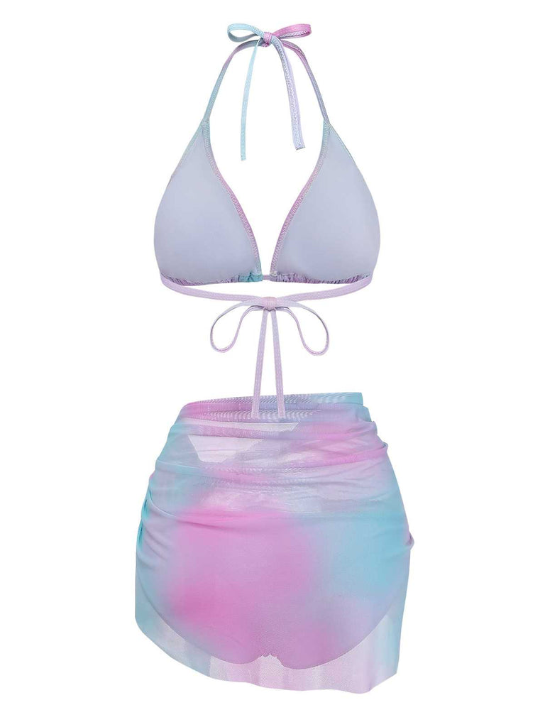 Studioansicht von vorne: Das pastellfarbene Ombré-Triangel-Bikini-Set wird mit dem passenden transparenten Sarong kombiniert.
