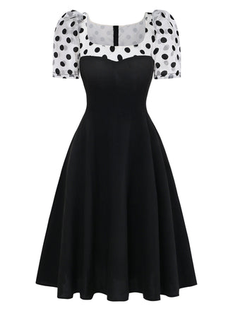 Schwarzes 1940er-Patchworkkleid mit Puffärmeln und Polka Dots