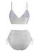 Rückansicht des silberglänzenden Bikini-Sets, die das metallische Finish und den hochgeschnittenen Bund zur Geltung bringt.
