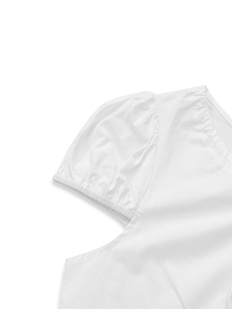 Detailaufnahme des elastischen Puffärmelbündchens, die die hochwertige Verarbeitung und die leichte Stoffstruktur hervorhebt.