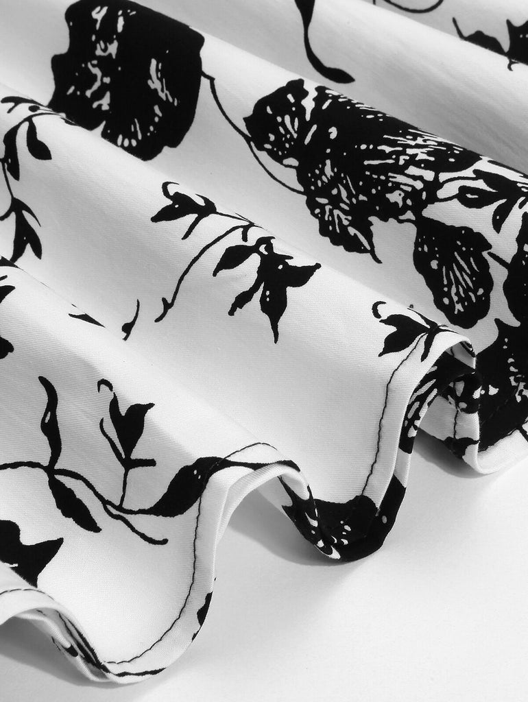 Schwarz 1950er Blumen Swing Kleid